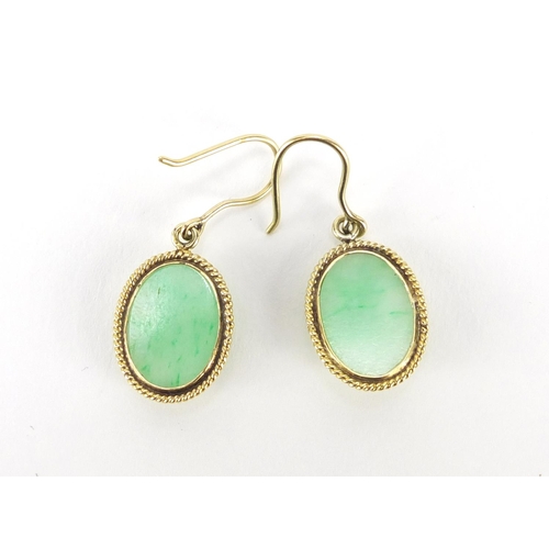 691 - Pair of unmarked gold green cabochon jade earrings (tests as 14ct+) 3.5cm in length, 5.0g