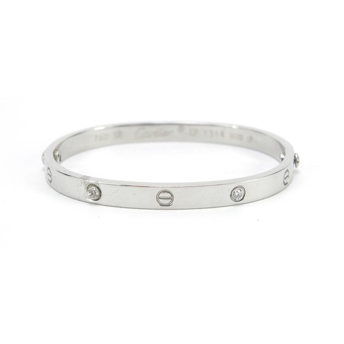 647 - ** WITHDRAWN ** 18ct white gold bangle set with clear stones, housed in a Cartier tooled leather box... 