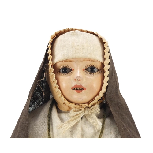 132 - 19th century doll with composite limbs and beaded eyes, 30cm high