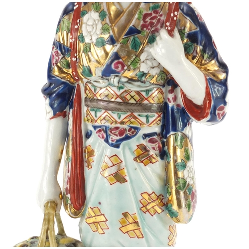 393 - Japanese porcelain figurine of a girl holding a basket, 33cm high