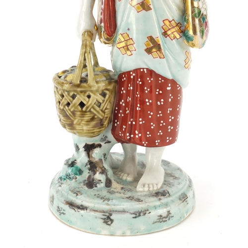 393 - Japanese porcelain figurine of a girl holding a basket, 33cm high