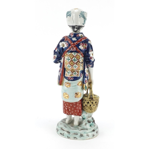 393 - Japanese porcelain figurine of a girl holding a basket, 33cm high