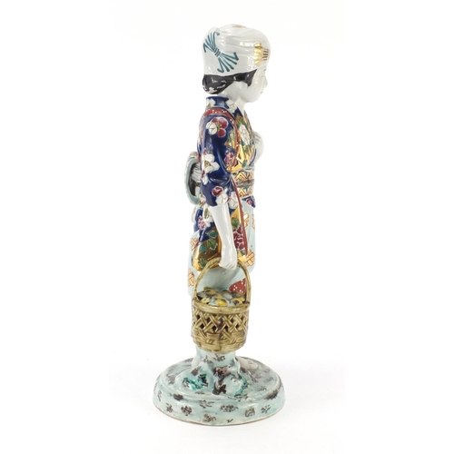 393 - Japanese porcelain figurine of a girl holding a basket, 33cm high