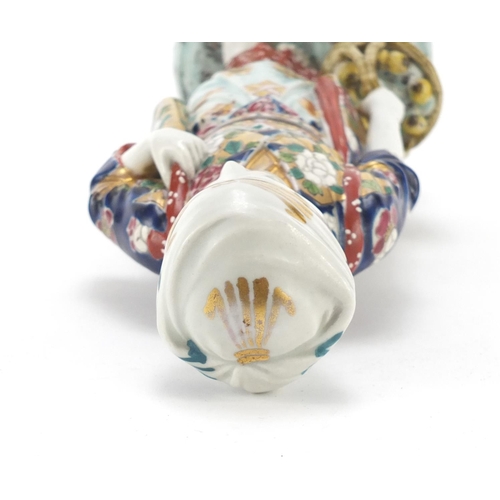 393 - Japanese porcelain figurine of a girl holding a basket, 33cm high