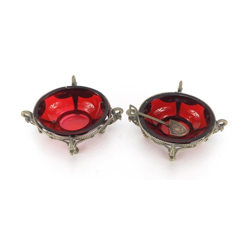 634 - Pair of Victorian novelty silver plated swan design salts with ruby glass liners, one with a spade d... 