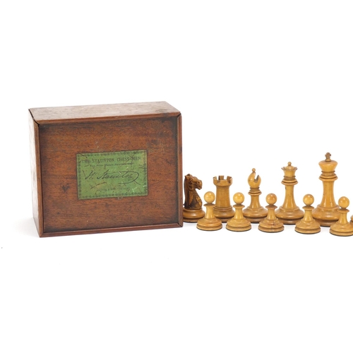 125 - Staunton boxwood and ebony chess set, by Jaques & Son of London with mahogany box, the slide off lid... 