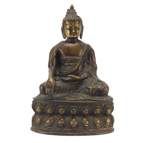 380 - Chino Tibetan patinated bronze figure of Buddha, 32cm high