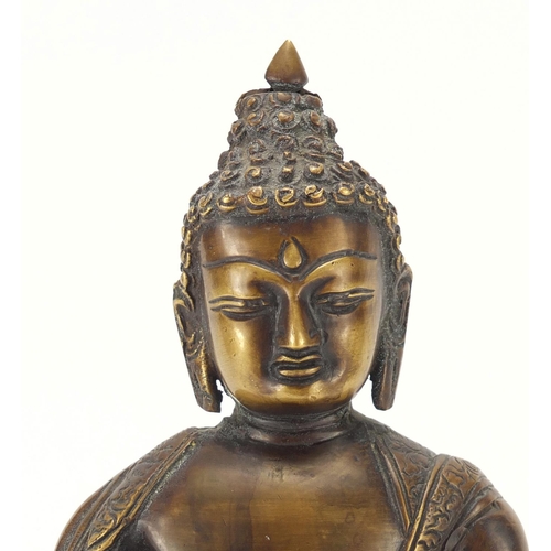 380 - Chino Tibetan patinated bronze figure of Buddha, 32cm high