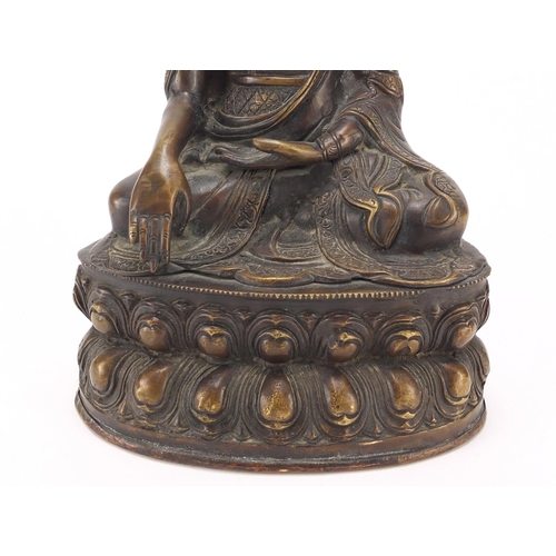 380 - Chino Tibetan patinated bronze figure of Buddha, 32cm high