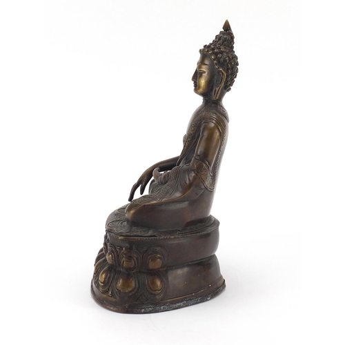 380 - Chino Tibetan patinated bronze figure of Buddha, 32cm high