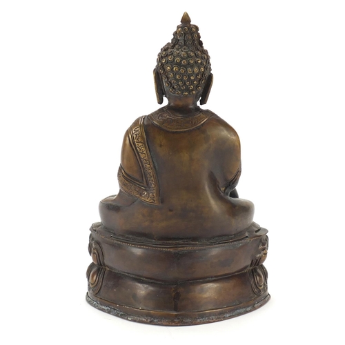 380 - Chino Tibetan patinated bronze figure of Buddha, 32cm high