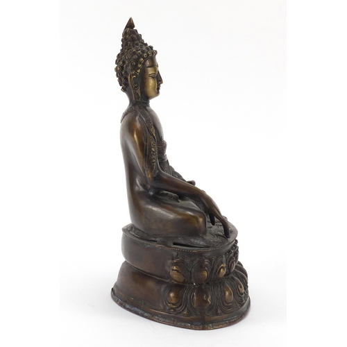 380 - Chino Tibetan patinated bronze figure of Buddha, 32cm high