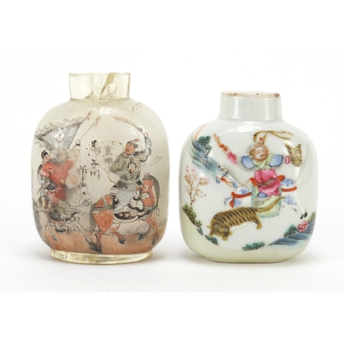 348 - Two Chinese snuff bottles including a porcelain example finely hand painted with figures and animals... 