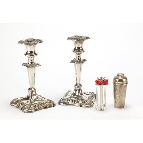 183 - Pair of silver plated candlesticks and a set of cocktail stirrers in the form of a miniature cocktai... 