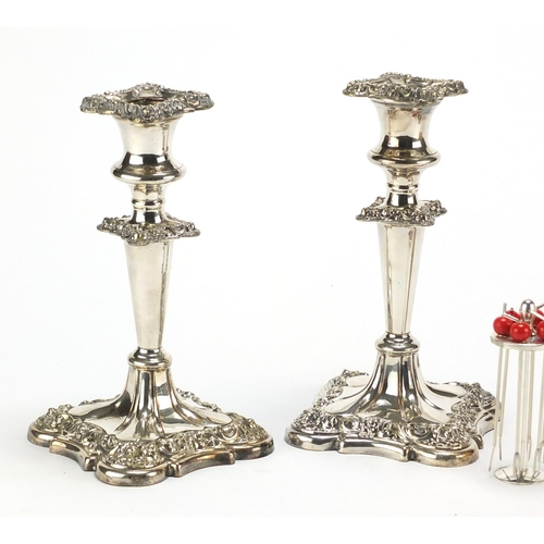 183 - Pair of silver plated candlesticks and a set of cocktail stirrers in the form of a miniature cocktai... 