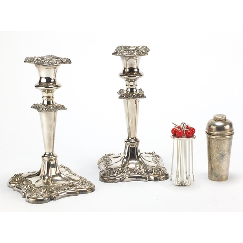 183 - Pair of silver plated candlesticks and a set of cocktail stirrers in the form of a miniature cocktai... 