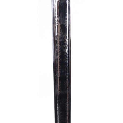 275 - British Military dress sword with scabbard, the steel blade engraved with Regimental motifs, 103cm i... 