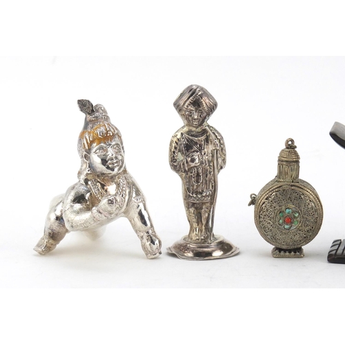 614 - Two unmarked silver Indian figures, a Tibetan scent bottle and African head rest, the largest 10cm i... 