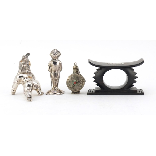 614 - Two unmarked silver Indian figures, a Tibetan scent bottle and African head rest, the largest 10cm i... 