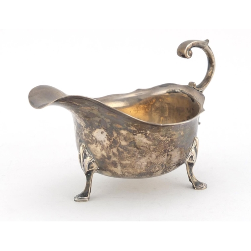 596 - Silver sauce boat by James Dixon & Sons Ltd, raised on with three hoof feet, Sheffield 1937, 15.5cm ... 