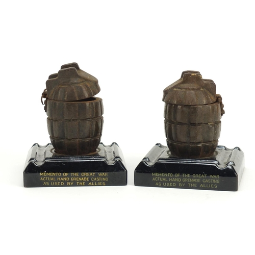 252 - Pair of British Military hand grenade cast design inkwells, each 12.5cm high