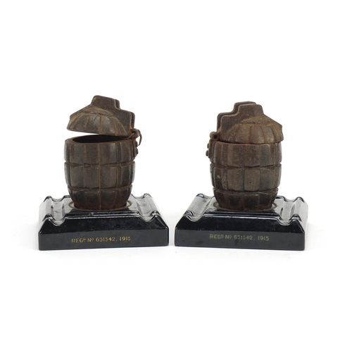 252 - Pair of British Military hand grenade cast design inkwells, each 12.5cm high