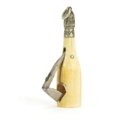 86 - Novelty ivory cigar cutter in the form of a champagne bottle, 5.3cm in high