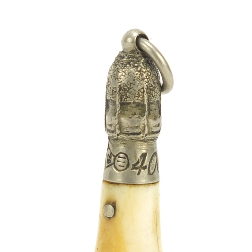 86 - Novelty ivory cigar cutter in the form of a champagne bottle, 5.3cm in high