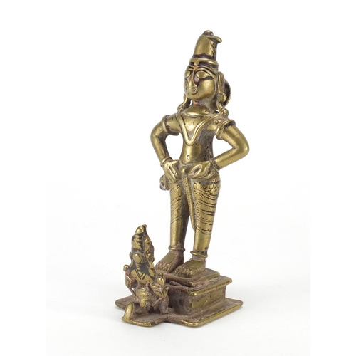 188 - Tibetan bronzed figure of a praying to a God, 16cm high