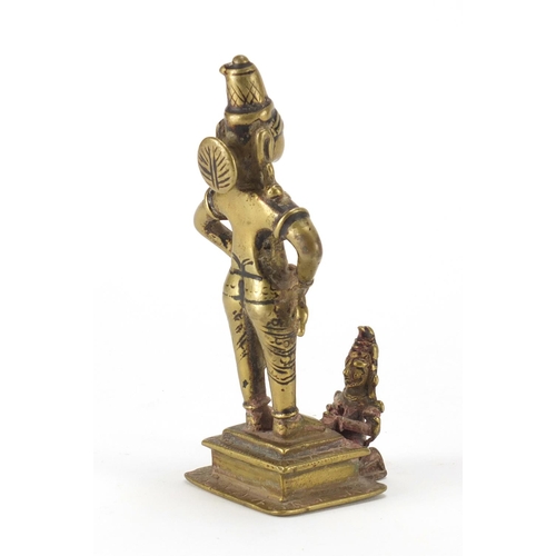 188 - Tibetan bronzed figure of a praying to a God, 16cm high