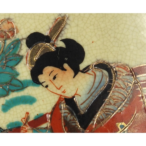 221 - Japanese porcelain wash bowl and jug, decorated with females in a courtyard, the jug 27cm high