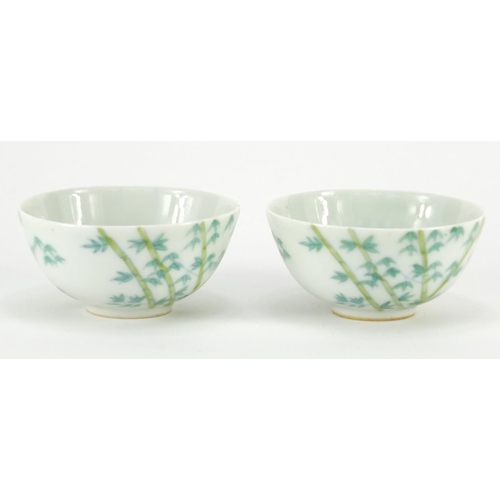 311 - Pair of Chinese porcelain bowls hand painted with bamboo, character marks to the bases, each 9cm in ... 