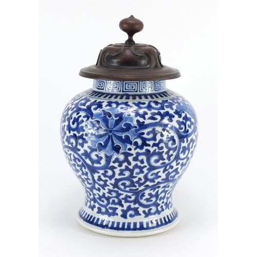 306 - Chinese blue and white porcelain baluster vase, hand painted with flower heads amongst scrolling fol... 