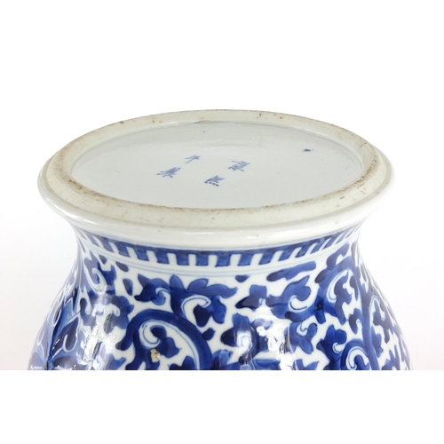 306 - Chinese blue and white porcelain baluster vase, hand painted with flower heads amongst scrolling fol... 