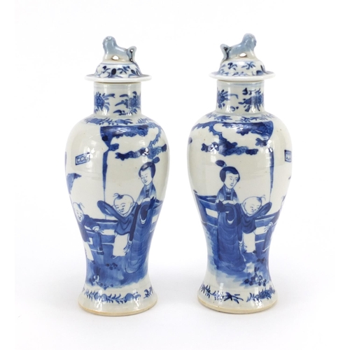 359 - Pair of Chinese blue and white baluster vases with covers, hand painted with figures, blue ring mark... 