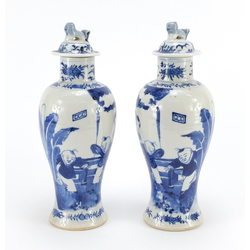 359 - Pair of Chinese blue and white baluster vases with covers, hand painted with figures, blue ring mark... 