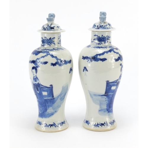 359 - Pair of Chinese blue and white baluster vases with covers, hand painted with figures, blue ring mark... 