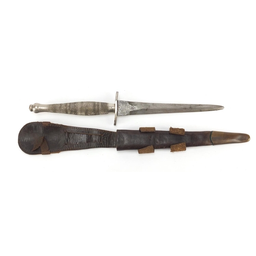 272 - Military Interest Fairbairn Sykes fighting knife by Wilkinson Sword with leather sheath and wavy hil... 