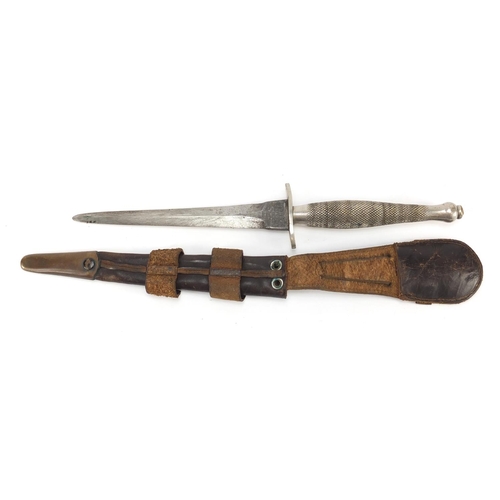 272 - Military Interest Fairbairn Sykes fighting knife by Wilkinson Sword with leather sheath and wavy hil... 