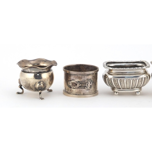 599 - Silver cruet items and a circular silver napkin ring, various hallmarks, the largest 8.5cm high, 235... 