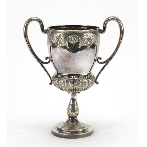 185 - Large silver plated twin handled trophy engraved and embossed with flowers, 27cm high