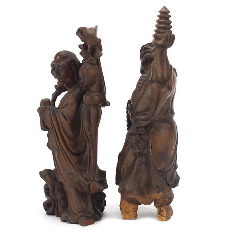 399 - Two Chinese root carvings of elders, the largest 21cm high