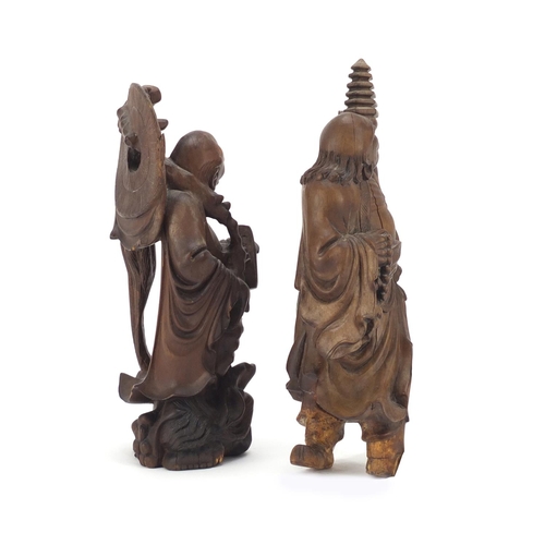 399 - Two Chinese root carvings of elders, the largest 21cm high