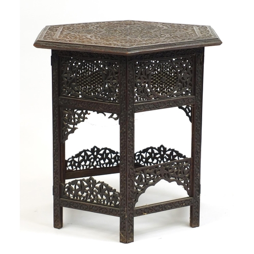 127 - Anglo-Indian carved wood occasional table with folding base, 62cm H x 60cm W x 60cm D