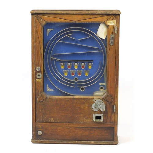 141 - 1920's oak cased penny pinball slot machine, 83cm H x 55.4cm W x 21.5cm D