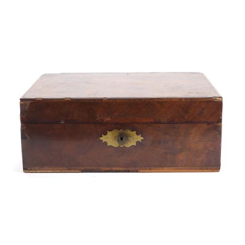 72 - Victorian cross banded walnut writing box with fitted leather interior, having silver coloured mount... 