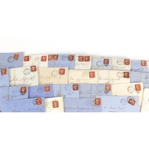 160 - Collection of Victorian postal history covers with penny red stamps in included a mourning cover wit... 