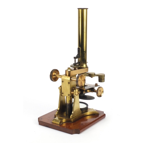 40 - Victorian brass microscope with accessories and case by J & C Arobbins of London, 34.5cm high
