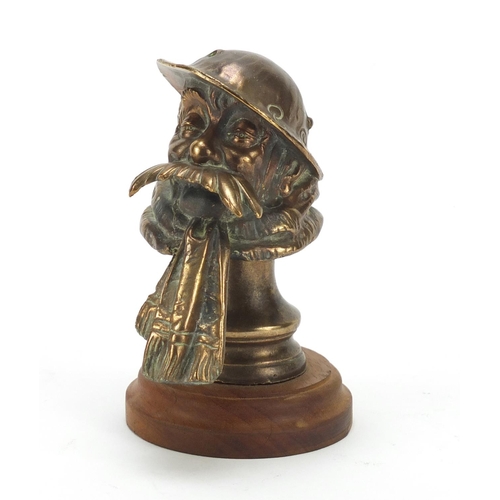 61 - Bruce Bairnsfather car mascot raised on a wood stand, the mascot 12.5cm high