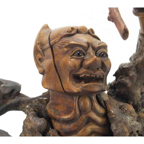 398 - Chinese hardwood root carving of a devil, approximately 40cm high